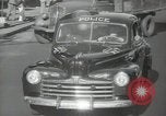Image of New York City police car driving in midtown Manhattan New York City USA, 1939, second 39 stock footage video 65675032802