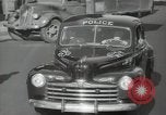 Image of New York City police car driving in midtown Manhattan New York City USA, 1939, second 40 stock footage video 65675032802