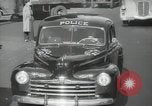 Image of New York City police car driving in midtown Manhattan New York City USA, 1939, second 43 stock footage video 65675032802