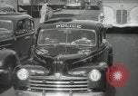 Image of New York City police car driving in midtown Manhattan New York City USA, 1939, second 45 stock footage video 65675032802