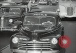 Image of New York City police car driving in midtown Manhattan New York City USA, 1939, second 46 stock footage video 65675032802