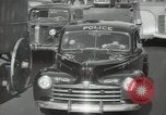 Image of New York City police car driving in midtown Manhattan New York City USA, 1939, second 47 stock footage video 65675032802