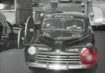 Image of New York City police car driving in midtown Manhattan New York City USA, 1939, second 48 stock footage video 65675032802