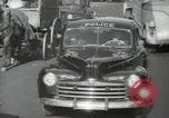 Image of New York City police car driving in midtown Manhattan New York City USA, 1939, second 49 stock footage video 65675032802