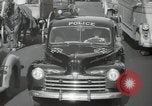 Image of New York City police car driving in midtown Manhattan New York City USA, 1939, second 50 stock footage video 65675032802