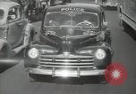 Image of New York City police car driving in midtown Manhattan New York City USA, 1939, second 51 stock footage video 65675032802