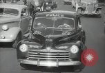 Image of New York City police car driving in midtown Manhattan New York City USA, 1939, second 52 stock footage video 65675032802