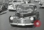 Image of New York City police car driving in midtown Manhattan New York City USA, 1939, second 54 stock footage video 65675032802