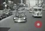 Image of New York City police car driving in midtown Manhattan New York City USA, 1939, second 56 stock footage video 65675032802