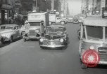 Image of New York City police car driving in midtown Manhattan New York City USA, 1939, second 62 stock footage video 65675032802