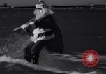 Image of Santa Claus on water skis Miami Florida USA, 1937, second 9 stock footage video 65675032891