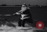 Image of Santa Claus on water skis Miami Florida USA, 1937, second 10 stock footage video 65675032891
