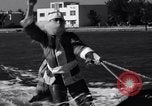 Image of Santa Claus on water skis Miami Florida USA, 1937, second 17 stock footage video 65675032891