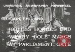 Image of British unemployed people march in protest United Kingdom, 1932, second 1 stock footage video 65675033280