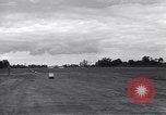 Image of P-51s of 354th Fighter Group landing Criqueville France, 1944, second 32 stock footage video 65675033408
