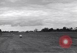 Image of P-51s of 354th Fighter Group landing Criqueville France, 1944, second 36 stock footage video 65675033408