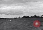 Image of P-51s of 354th Fighter Group landing Criqueville France, 1944, second 38 stock footage video 65675033408