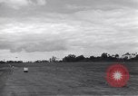 Image of P-51s of 354th Fighter Group landing Criqueville France, 1944, second 46 stock footage video 65675033408
