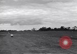 Image of P-51s of 354th Fighter Group landing Criqueville France, 1944, second 48 stock footage video 65675033408