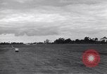Image of P-51s of 354th Fighter Group landing Criqueville France, 1944, second 49 stock footage video 65675033408