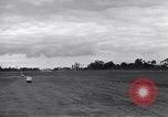 Image of P-51s of 354th Fighter Group landing Criqueville France, 1944, second 50 stock footage video 65675033408