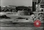 Image of Wrecked Planes Hangars and Ships Pearl Harbor Hawaii USA, 1942, second 12 stock footage video 65675033414
