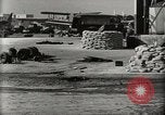 Image of Wrecked Planes Hangars and Ships Pearl Harbor Hawaii USA, 1942, second 13 stock footage video 65675033414