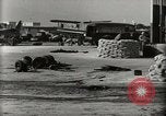 Image of Wrecked Planes Hangars and Ships Pearl Harbor Hawaii USA, 1942, second 14 stock footage video 65675033414