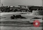 Image of Wrecked Planes Hangars and Ships Pearl Harbor Hawaii USA, 1942, second 15 stock footage video 65675033414