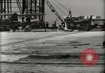 Image of Wrecked Planes Hangars and Ships Pearl Harbor Hawaii USA, 1942, second 17 stock footage video 65675033414