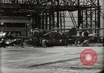 Image of Wrecked Planes Hangars and Ships Pearl Harbor Hawaii USA, 1942, second 20 stock footage video 65675033414