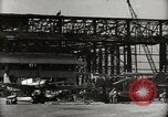 Image of Wrecked Planes Hangars and Ships Pearl Harbor Hawaii USA, 1942, second 24 stock footage video 65675033414