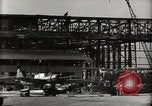 Image of Wrecked Planes Hangars and Ships Pearl Harbor Hawaii USA, 1942, second 26 stock footage video 65675033414