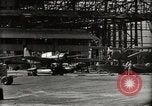Image of Wrecked Planes Hangars and Ships Pearl Harbor Hawaii USA, 1942, second 27 stock footage video 65675033414