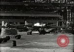 Image of Wrecked Planes Hangars and Ships Pearl Harbor Hawaii USA, 1942, second 28 stock footage video 65675033414