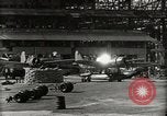 Image of Wrecked Planes Hangars and Ships Pearl Harbor Hawaii USA, 1942, second 30 stock footage video 65675033414