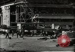 Image of Wrecked Planes Hangars and Ships Pearl Harbor Hawaii USA, 1942, second 36 stock footage video 65675033414