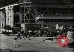 Image of Wrecked Planes Hangars and Ships Pearl Harbor Hawaii USA, 1942, second 37 stock footage video 65675033414