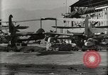 Image of Wrecked Planes Hangars and Ships Pearl Harbor Hawaii USA, 1942, second 56 stock footage video 65675033414