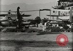 Image of Wrecked Planes Hangars and Ships Pearl Harbor Hawaii USA, 1942, second 57 stock footage video 65675033414