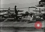 Image of Wrecked Planes Hangars and Ships Pearl Harbor Hawaii USA, 1942, second 58 stock footage video 65675033414