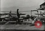 Image of Wrecked Planes Hangars and Ships Pearl Harbor Hawaii USA, 1942, second 59 stock footage video 65675033414