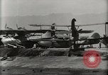 Image of Wrecked Planes Hangars and Ships Pearl Harbor Hawaii USA, 1942, second 60 stock footage video 65675033414