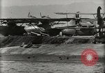Image of Wrecked Planes Hangars and Ships Pearl Harbor Hawaii USA, 1942, second 61 stock footage video 65675033414