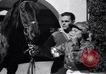Image of girl jockeys Mexico, 1939, second 11 stock footage video 65675033936