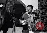 Image of girl jockeys Mexico, 1939, second 12 stock footage video 65675033936