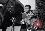 Image of girl jockeys Mexico, 1939, second 13 stock footage video 65675033936