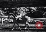 Image of girl jockeys Mexico, 1939, second 27 stock footage video 65675033936
