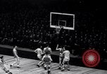 Image of college basketball game New York City USA, 1940, second 45 stock footage video 65675033945