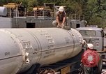 Image of loading dockside to submarine United States USA, 1964, second 29 stock footage video 65675034571
